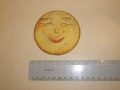 Plastic-disc-with-face